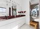Bright bathroom featuring a granite vanity top, decorative mirror, shower, and stool at 5740 Bounty Cir, Tavares, FL 32778