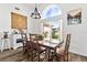 Dining area with stylish table and chairs, large windows, and decor at 5740 Bounty Cir, Tavares, FL 32778