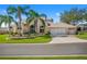 Inviting single Gathering home with a 3-car garage and lush landscaping at 5740 Bounty Cir, Tavares, FL 32778
