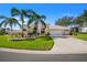 Inviting single Gathering home with a 3-car garage and lush landscaping at 5740 Bounty Cir, Tavares, FL 32778