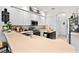 Bright white kitchen featuring modern appliances and a charming island for meal prep at 5740 Bounty Cir, Tavares, FL 32778