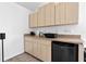 Functional kitchenette featuring modern appliances and ample cabinet space at 5740 Bounty Cir, Tavares, FL 32778
