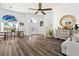 Bright, open-concept living area featuring hardwood floors, high ceilings, and abundant natural light at 5740 Bounty Cir, Tavares, FL 32778
