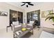 Cozy covered patio with comfortable seating, perfect for outdoor entertaining at 5740 Bounty Cir, Tavares, FL 32778