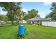 Spacious backyard with lush greenery, patio, and full privacy fence at 8160 Se 164Th Pl, Summerfield, FL 34491