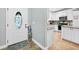 Light and bright foyer featuring a decorative front door that leads to the kitchen at 8160 Se 164Th Pl, Summerfield, FL 34491