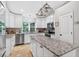 Kitchen with stainless appliances, granite counters and island with seating at 8160 Se 164Th Pl, Summerfield, FL 34491