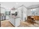 Kitchen with granite countertops and stainless steel appliances opens to the dining area at 8160 Se 164Th Pl, Summerfield, FL 34491