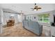 Spacious living room and dining area showcasing tile flooring, ceiling fans, and large windows at 8160 Se 164Th Pl, Summerfield, FL 34491