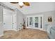 Relaxing sun room featuring neutral paint, a door to the backyard, and tile flooring at 8160 Se 164Th Pl, Summerfield, FL 34491