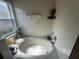 This bathroom features a large soaking tub at 15509 Markham Dr, Clermont, FL 34714