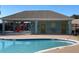 Community pool with covered picnic area and playground nearby at 15509 Markham Dr, Clermont, FL 34714