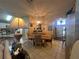 Dining room with tile flooring, chandelier, and view into the foyer and entryway at 15509 Markham Dr, Clermont, FL 34714