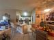 Open floorplan with a kitchen island and dining room space with a view into the living room at 15509 Markham Dr, Clermont, FL 34714