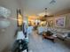 The living room features tile floors and a ceiling fan at 15509 Markham Dr, Clermont, FL 34714