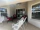 This covered patio features outdoor seating at 15509 Markham Dr, Clermont, FL 34714