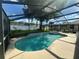 Backyard pool with screened enclosure at 15509 Markham Dr, Clermont, FL 34714