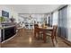 Dining room with wood floors, fireplace, ceiling fan and large windows at 1025 Capella Dr, Tavares, FL 32778
