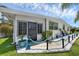 Close-up of a charming entrance with potted plants and decorative nautical-themed rope fencing at 1025 Capella Dr, Tavares, FL 32778