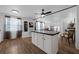 Spacious kitchen with center island, appliances and white cabinetry at 1025 Capella Dr, Tavares, FL 32778