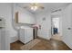 Functional laundry room with a washer, dryer, cabinets, and counter space at 1025 Capella Dr, Tavares, FL 32778
