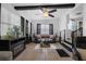 Comfortable living room with ceiling fan and view of the staircase at 1025 Capella Dr, Tavares, FL 32778
