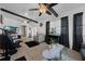 Bright living room featuring two ceiling fans, fireplace and neutral decor at 1025 Capella Dr, Tavares, FL 32778