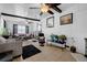 Bright living room with tile flooring, ceiling fans, and ample natural light at 1025 Capella Dr, Tavares, FL 32778