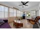 Bright sun room with comfortable seating and ample natural light at 1025 Capella Dr, Tavares, FL 32778