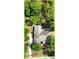 Aerial view of the house showcasing the roof and surrounding greenery at 1053 Cavern Dr, Apopka, FL 32712