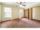 Bedroom with carpeted flooring, standard closet, ceiling fan, and natural light from the windows at 1053 Cavern Dr, Apopka, FL 32712