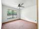 Simple carpeted room with a large window bringing the outside in at 1053 Cavern Dr, Apopka, FL 32712