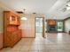 View of open dining room with hutch, transitioning to living area with a brick fireplace at 1053 Cavern Dr, Apopka, FL 32712