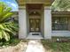 Inviting front entrance with double doors and a well-maintained walkway at 1053 Cavern Dr, Apopka, FL 32712