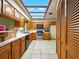 Bright kitchen with light wood cabinets, a breakfast bar and skylights that offer tons of light at 1053 Cavern Dr, Apopka, FL 32712