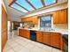 Spacious kitchen featuring light wood cabinets, lots of counter space, and skylights for bright light at 1053 Cavern Dr, Apopka, FL 32712