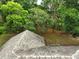 Aerial view of a well maintained roof surrounded by tall trees and natural landscaping at 1053 Cavern Dr, Apopka, FL 32712