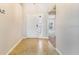 Inviting foyer with tile flooring and natural light streaming through the front door at 1055 Bluegrass Dr, Groveland, FL 34736