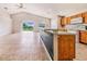 Kitchen with breakfast bar overlooking the living area, offering a seamless flow for entertaining at 1055 Bluegrass Dr, Groveland, FL 34736