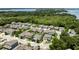 Aerial view showcasing a well-planned neighborhood with uniform houses, manicured lawns, and tree-lined streets at 1131 Dora Parc Ln, Mount Dora, FL 32757