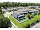 Aerial view of neighborhood houses showcasing fenced yards, green spaces, and a tranquil community atmosphere at 1131 Dora Parc Ln, Mount Dora, FL 32757