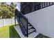 These backyard stairs leading up to a screened porch provide convenient access to enjoy the backyard from above at 1131 Dora Parc Ln, Mount Dora, FL 32757