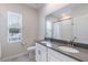Bathroom featuring a dual sink vanity and a shower with a curtain over the bath at 1131 Dora Parc Ln, Mount Dora, FL 32757