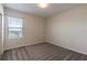 Bright and airy bedroom with plush carpet and a large window at 1131 Dora Parc Ln, Mount Dora, FL 32757
