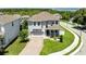 Beautiful two-story home with a well-kept lawn and a paver driveway, complete with a two-car garage at 1131 Dora Parc Ln, Mount Dora, FL 32757