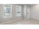 Versatile flex room with neutral walls, tiled floor, and bright natural light from two large windows at 1131 Dora Parc Ln, Mount Dora, FL 32757