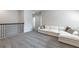 Loft with a white sofa on gray carpet at 1131 Dora Parc Ln, Mount Dora, FL 32757