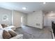 Loft area with a white sofa and gray carpet at 1131 Dora Parc Ln, Mount Dora, FL 32757