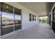 Relax on this spacious screened porch with sliding glass doors, offering a seamless transition to indoor living spaces at 1131 Dora Parc Ln, Mount Dora, FL 32757
