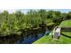 This beautiful shot overlooks calm waters surrounded by lush foliage, perfect for nature lovers and serene living at 1131 Dora Parc Ln, Mount Dora, FL 32757